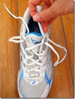 Photograph demonstrating how to create "bunny ears" with the laces of your running shoes to ensure they do not come untied during your run.